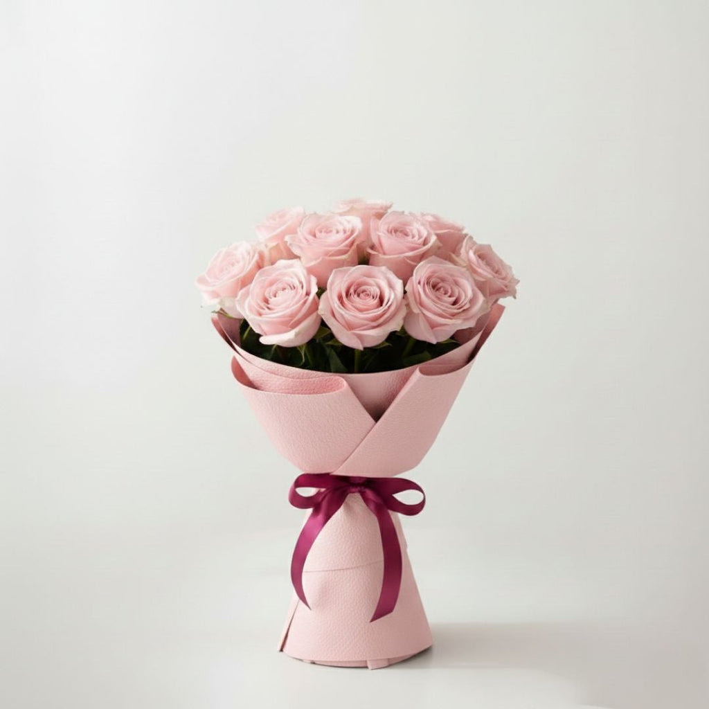 Soft Glow Celebration-11 Light Pink Roses by Black Petals Flowers